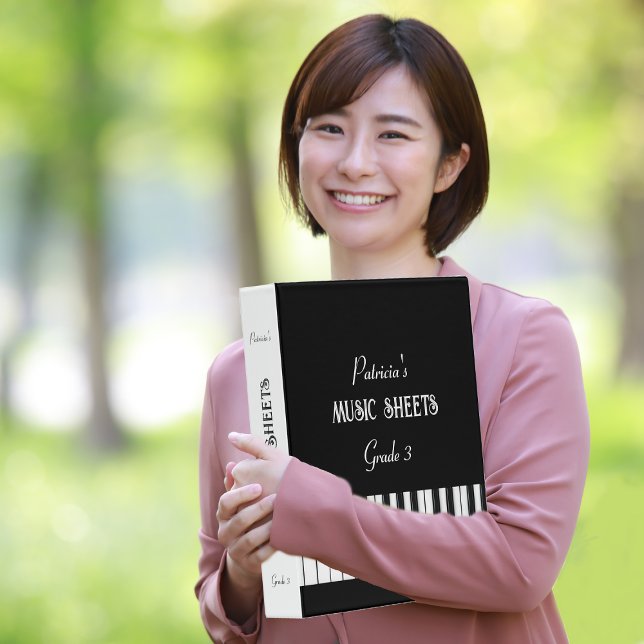 Piano Keyboard and customizable text black & white Binder (piano keyboard binder with customizable script held by a lady)