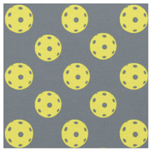 Pickleballs on dark grey fabric