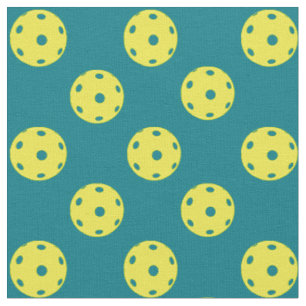 Pickleballs on turquoise fabric