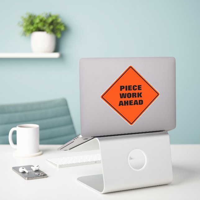 Piece work ahead diamond caution road sign  (Laptop On Desk)