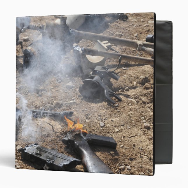 Pieces of enemy weapons lay out to cool off binder (Front/Inside)
