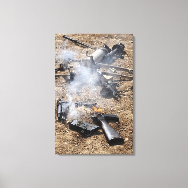 Pieces of enemy weapons lay out to cool off canvas print (Front)