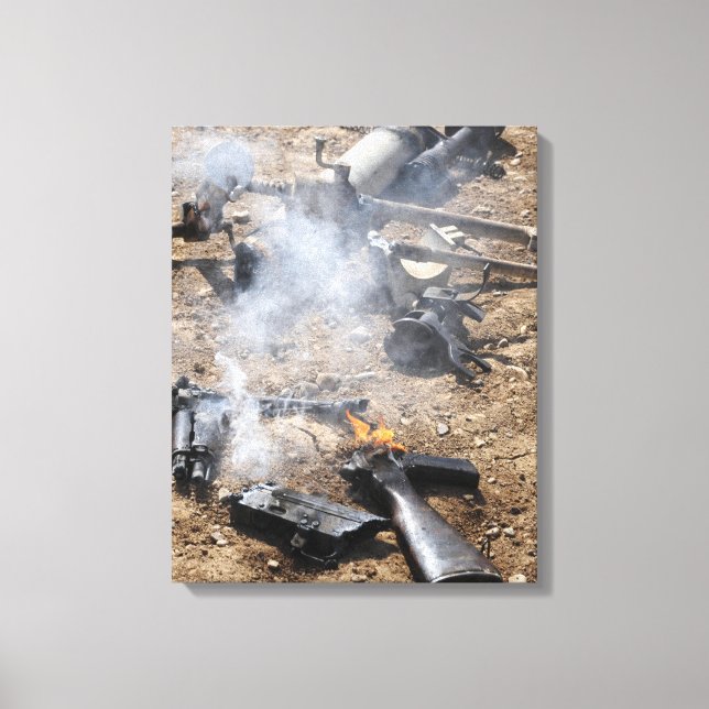 Pieces of enemy weapons lay out to cool off canvas print (Front)