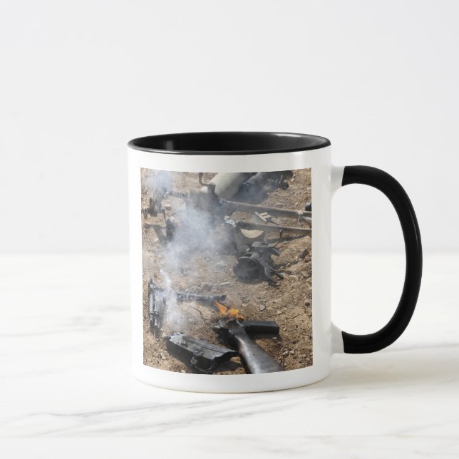 Pieces of enemy weapons lay out to cool off mug (Right)