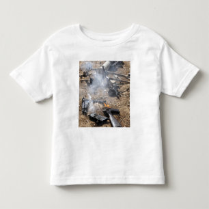 Pieces of enemy weapons lay out to cool off toddler t-shirt