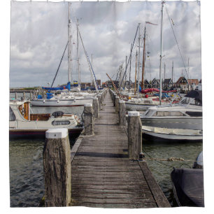 Pier with boats and yachts in Marken Netherlands