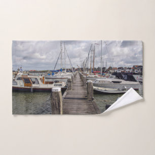 Pier with boats and yachts in Marken Netherlands Hand Towel