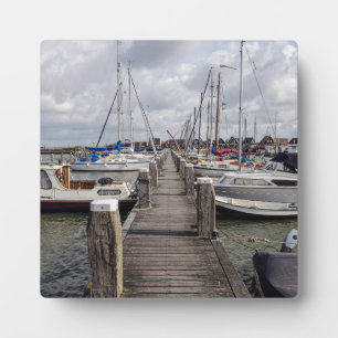 Pier with boats and yachts in Marken Netherlands Plaque
