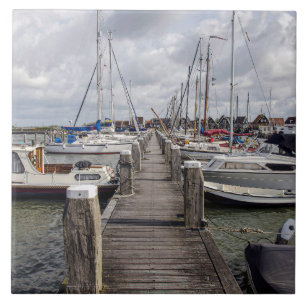 Pier with boats and yachts in Marken Netherlands Tile