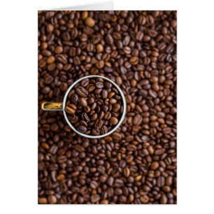 Pile of Coffee Beans with Coffee Cup Full of Beans