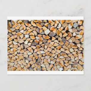 Pile of firewood as tree trunk postcard