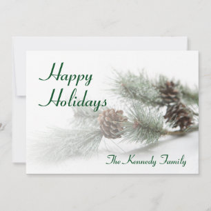 Pine cones on artificial pine branch with ice holiday card