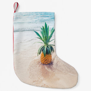 Pineapple fruit on beach shore in the morning small christmas stocking