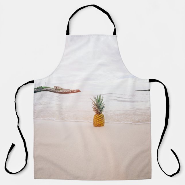 Pineapple on sand near beach apron (Front)
