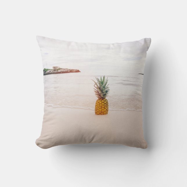 Pineapple on sand near beach throw pillow (Front)