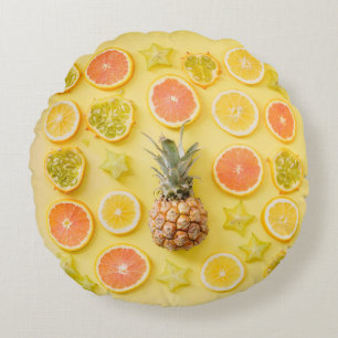 Pineapple surrounded by citrus fruits round pillow