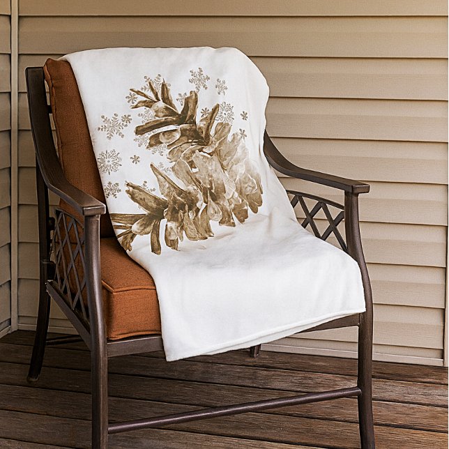 Pinecones rustiques dans la couverture en toison d (Warm and cozy pinecone and snowflake fleece blanket.  )