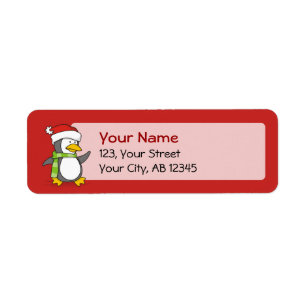 Pingouin de Noël marchant sur la neige