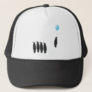 Pingouins avec le casquette de ballon