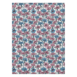 Pink and blue cornflowers on white tablecloth