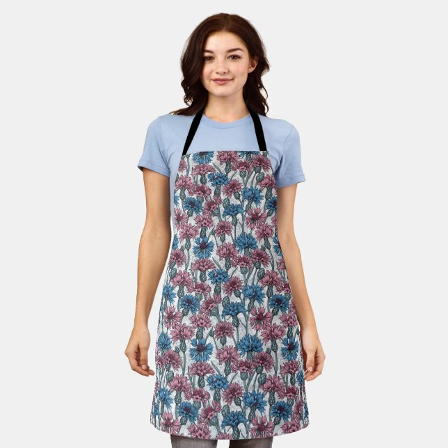 Pink and blue cornflowers, wild flowers on white apron (Worn)