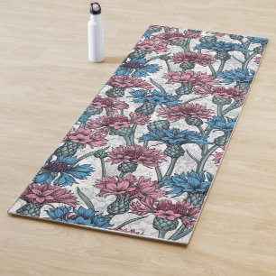 Pink and blue cornflowers, wild flowers on white yoga mat