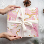 Pink and Gold Marble Christmas  Wrapping Paper<br><div class="desc">Transport yourself to a bygone era of festive nostalgia with our "Vintage Christmas Teddy Bears Red Wrapping Paper." This heartwarming design captures the timeless charm of classic holiday celebrations, featuring adorable teddy bears adorned in vintage Christmas attire. The rich red background sets the perfect stage for these endearing teddy bears,...</div>