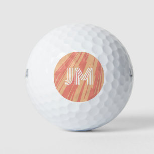 Pink and orange abstract retro design golf balls