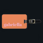 Pink and Orange Bold Typography Personalized Name Luggage Tag<br><div class="desc">Travel in style with this personalized luggage tag featuring a modern minimalist design. The pink elegant serif name stands out against a soft orange background, creating a chic and timeless look. Perfect for frequent travelers, business professionals, students, and vacationers who want to easily identify their bags. The back includes space...</div>