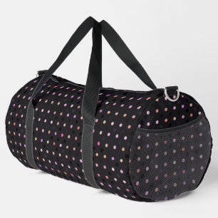 pink and purple polka dots on gray duffle bag