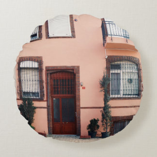 PINK AND RED CONCRETE BUILDING ROUND PILLOW