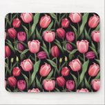 Pink and Red Floral Tulip Mouse Pad<br><div class="desc">This mousepad features vibrant pink and red tulip flowers that stand out against the dark contrasting background and the lush green leaves. This bold floral pattern exudes elegance and sophistication and is perfect for anyone who loves vibrant yet refined designs. The black background creates a stark contrast against the bright...</div>