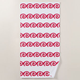 Pink and red spirals pattern on white beach towel