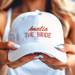 Pink and Red The Bride Bridal Party Personalized Embroidered Hat<br><div class="desc">Red script name with a pink description of "The Bride" embroidered baseball hat cap.</div>