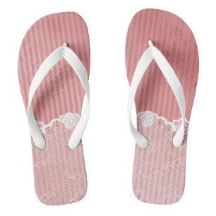 Pink and white background with black lace flip flops
