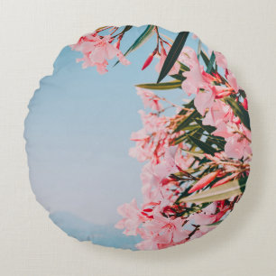 Pink and white petaled flowers round pillow