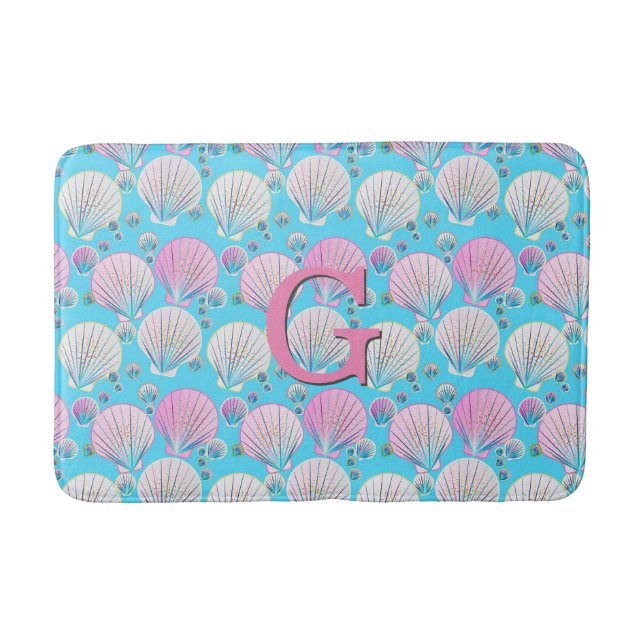 Pink and white sea shells on turquoise bath mat (Front)