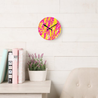 Pink and yellow spatter pattern round clock