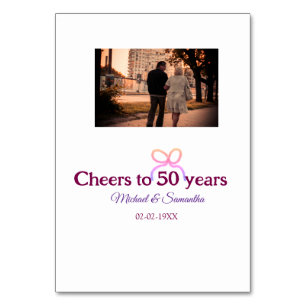 Pink bow cheers to 50 years anniversary wedding table number