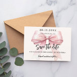 Pink bow cream Quinceanera Save the Date card<br><div class="desc">A modern and elegant Save the Date for a Quinceañera.   A soft cream,  beige coloured background,  decorated with a large pink bow. Personalize and add date,  place,  name and age.</div>