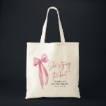Pink Bow She's Tying the Knot Bachelorette Party Tote Bag<br><div class="desc">Introducing the Pink Bow She's Tying the Knot Bachelorette Party Tote Bag – the perfect accessory for celebrating the bride-to-be! This chic tote bag features a stylish pink bow design with the phrase "She's Tying the Knot, " adding a touch of elegance to any bachelorette party. Made from durable, eco-friendly...</div>