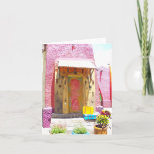 Pink building collects doorknockers on blank note card
