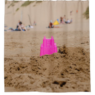 Pink castle toy in shore at daytime