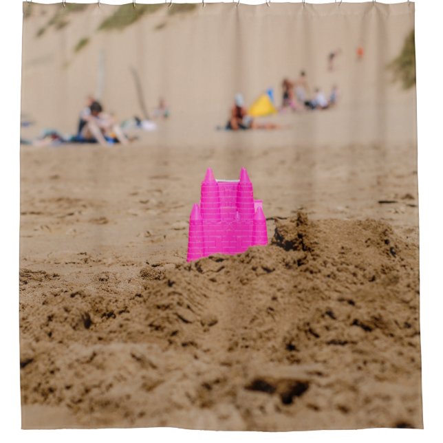 Pink castle toy in shore at daytime (Front)