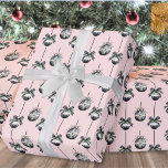 Pink Christmas Ornament Pattern Wrapping Paper<br><div class="desc">Wrap your gifts in style with this chic and girly Christmas wrapping paper featuring a repeating pattern of three elegant watercolor ornaments. Each ornament is softly shaded in black, white, and grey, accented by dainty bows and evergreen greenery for a modern yet festive feel. The background is a soft pink,...</div>