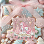 Pink Christmas Wonderland Unicorn  Square Sticker<br><div class="desc">Celebrate the magic of the holiday season with this enchanting "Pink Christmas Wonderland" sticker. Featuring a whimsical unicorn with a pastel pink mane, golden accents, and a regal crown, this design is surrounded by candy canes, a sparkling Christmas tree, ornaments, and snowflakes. Perfect for gift wrapping, holiday crafts, party favours,...</div>