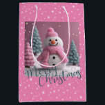 Pink Crocheted Christmas Snowman Medium Gift Bag<br><div class="desc">Pink Crocheted Christmas Snowman Gift Bag
Pretty Pink Background. Snowmans Hat,  Scarf
and Trees are of a Crocheted Digitally Created
Design. Merry Christmas written
across the Bottom in a Green Colour, 
Snowflakes to cover. Anyone would
love to get a gift in this bag.</div>