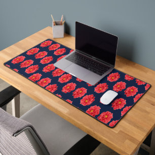Pink dahlia flower on blue desk mat