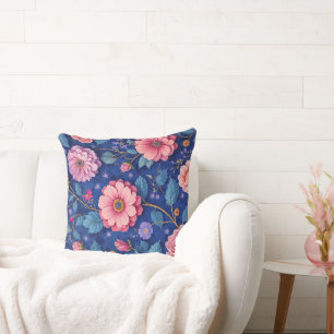 Pink flowers on vibrant blue pattern throw pillow