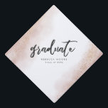 Pink Gold Watercolor Graduate Custom Graduation Cap Topper<br><div class="desc">Celebrate your graduation in style with this cap topper! This topper features pastel pink watercolor texture on the edges with faux gold glitter. In the middle it says "graduate" in modern script font. Customize this product by adding your name and class year.</div>